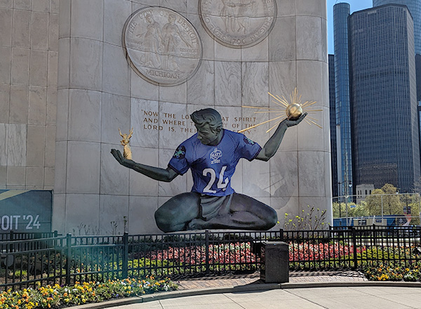 Spirit of Detroit wearing the Lions jersey.