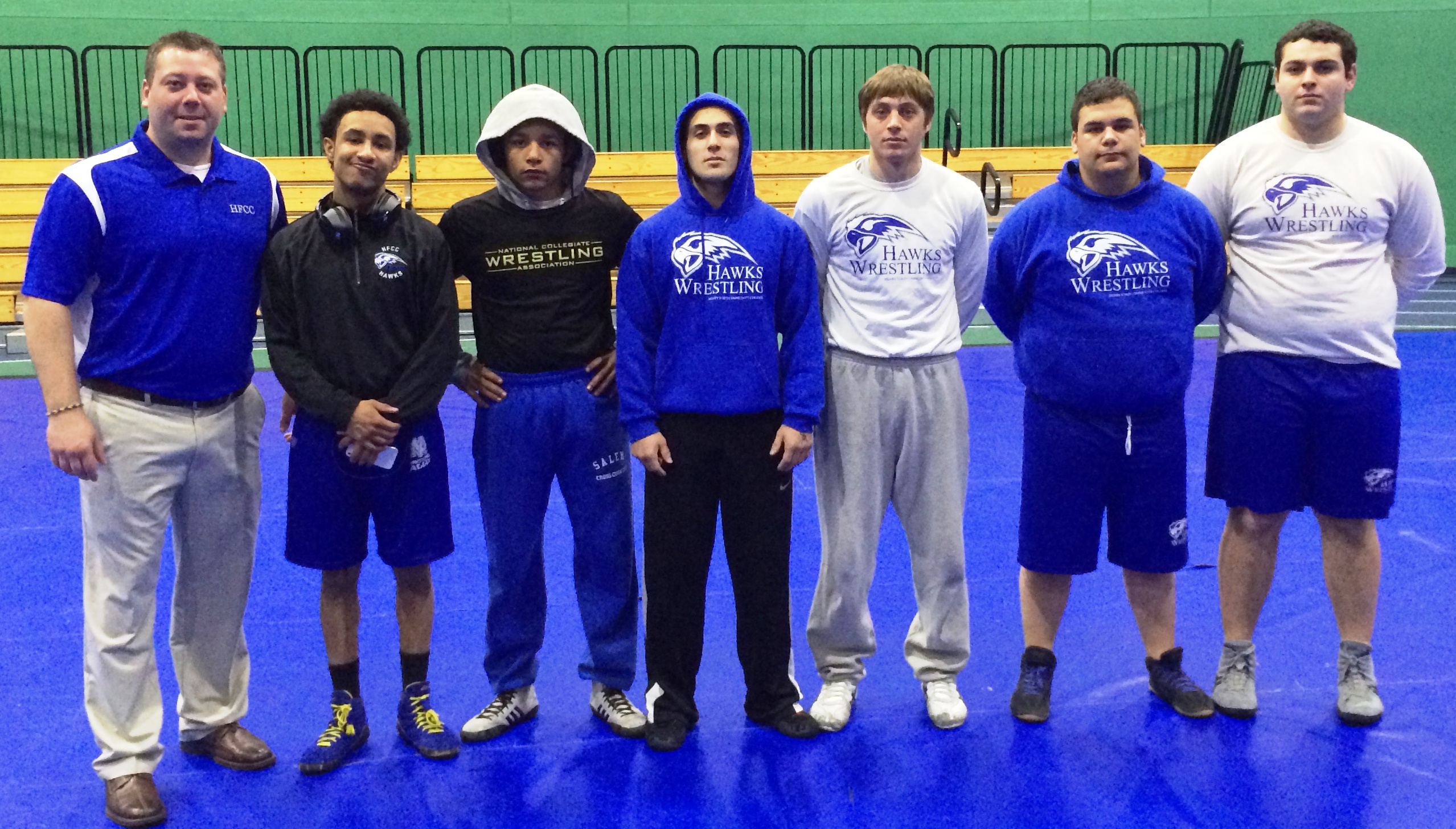 The HFCC Wrestling Club, left to right: Coach MacKenzie, Trey Berry of Plymouth (125 lb. class), Jesse O’Neal of Westland (133 lb. weight class), Ali Saad of Dearborn (141 lb. weight class), Jeremy Stankewitz of Plymouth (157 lb. weight class), Hass Doue