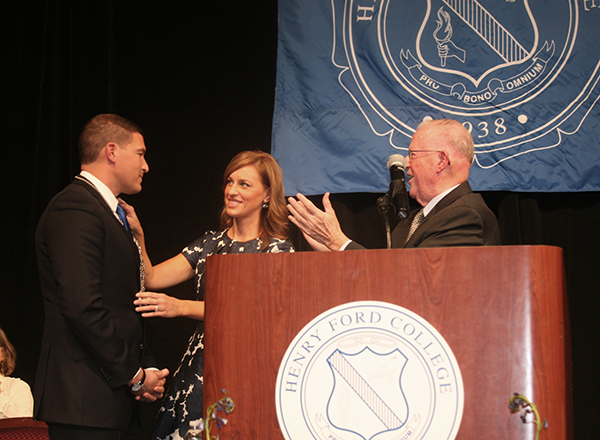 President Kavalhuna, his wife Courtney, and Board of Trustees Chair Michael Meade