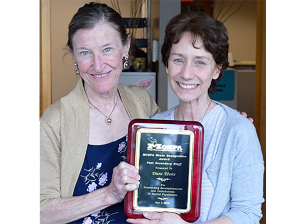 Maureen Webster (left) congratulates Diane Ebert on her award