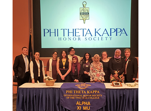 Group photo of the Nov. 16 ceremony featuring Kavalhuna, Nealon, and students 