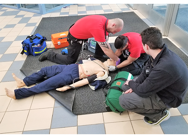 HFC EMS students assist Kelly, a human patient simulator. 