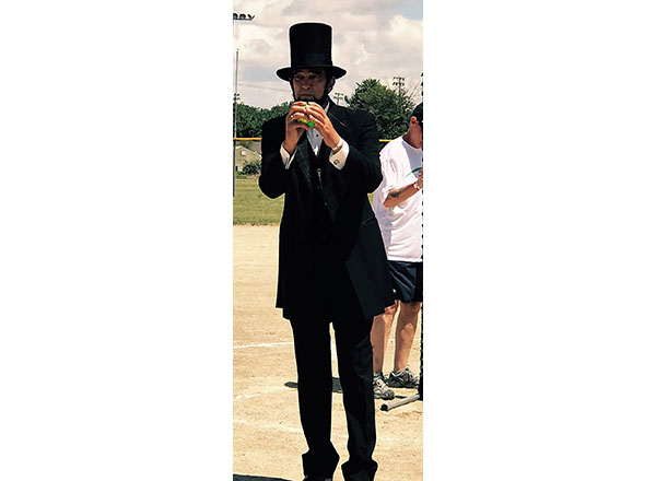 Abraham Lincoln (Ron Carley) throws the first pitch at the Celebrity Softball Tourney in Ferndale this past July. 