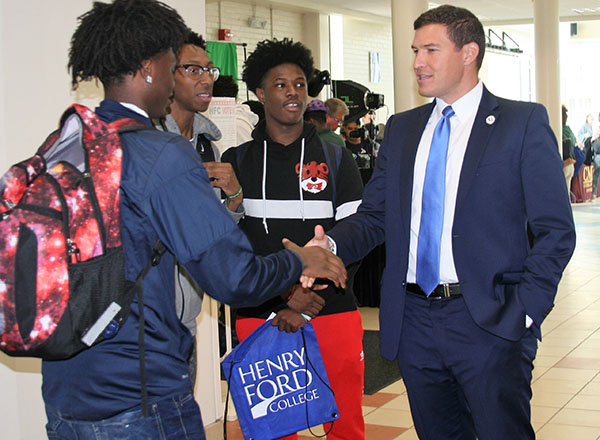 President Russell Kavalhuna chats with students during Discover Day. 