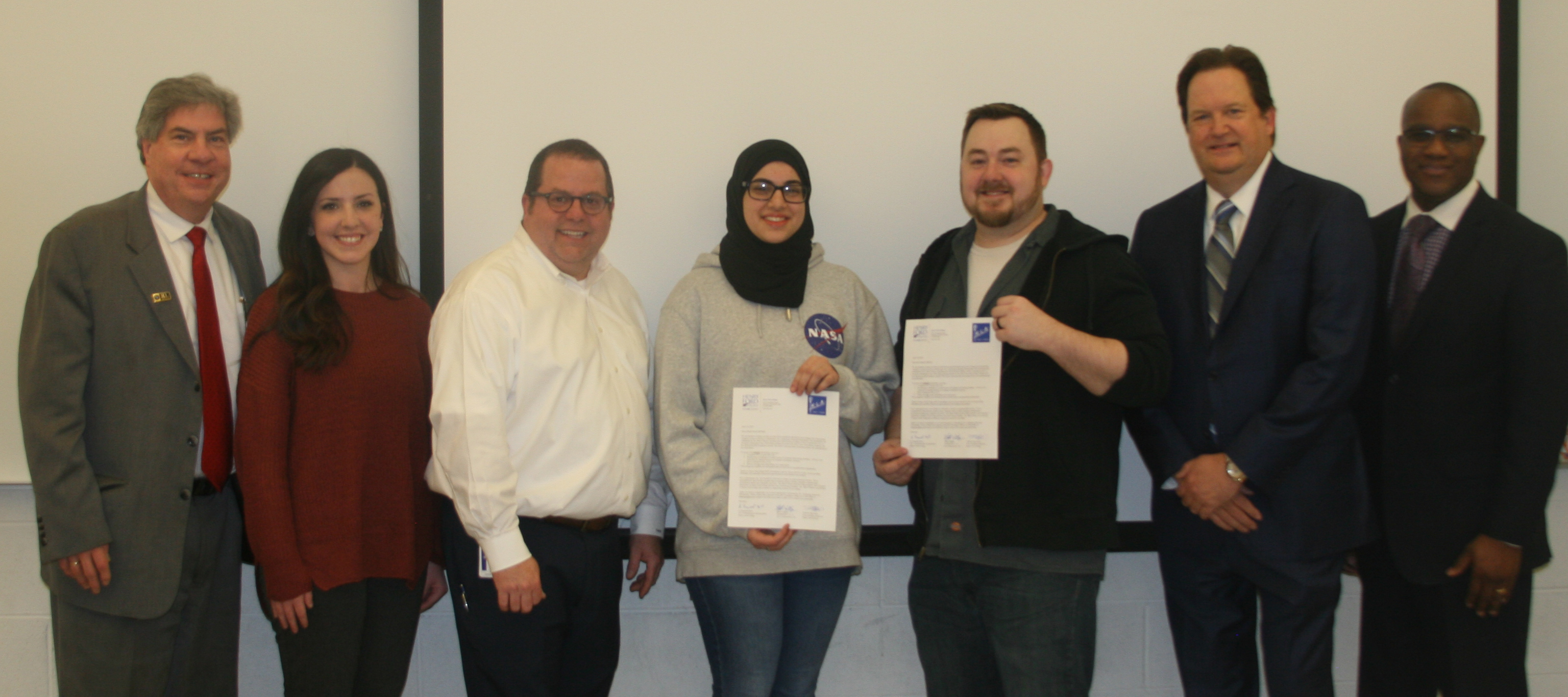 From left to right: Dr. Michael Nealon, HFC Vice President of Academic Affairs; Kelly Schoen, KLA Laboratories Marketing Coordinator; HFC Cisco lead instructor Todd Browning; scholarship winner Zainab Mroue; scholarship winner Kyle Harper; KLA Laboratori