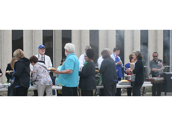 HFC leaders serve food to hungry faculty and staff.  