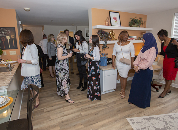 Students and guests peruse the 2-bedroom corner apartment. 