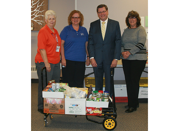 Members of HFC Financial Services contributed to the Hawks' Nest's recent food drive. From left to right: Sheryl Bieniak, Lisa Ivanics, David Cunningham, and Maureen Badalamente. 