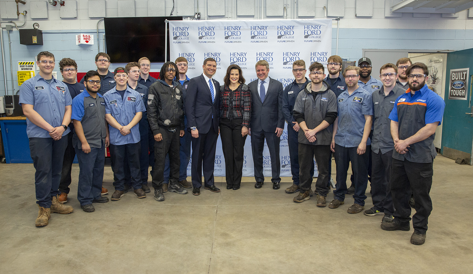 Governor Whitmer with a class of HFC automotive tech students, President Kavalhuna, and Henry Ford III.