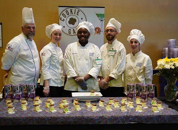 Group photo of Chef Jablonski and students in chef attire