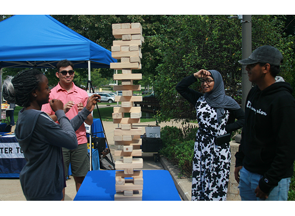 Students participate in a game of Jenga that drew quite the crowd. 