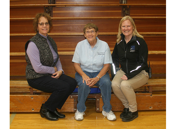 From left to right: Mary Jo Perkovich, Nancy Bryden, and Karen Schoen have a seat on the old bleachers before they're replaced. 