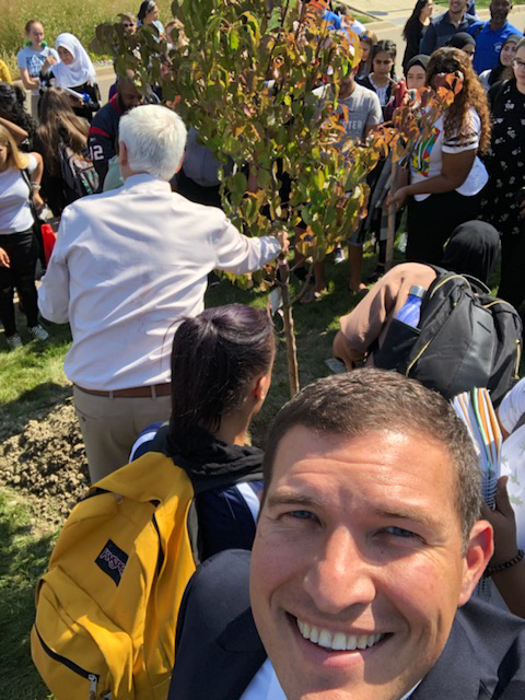 President Kavalhuna, students, faculty, and staff gathered to plant a tree on the HFC campus.