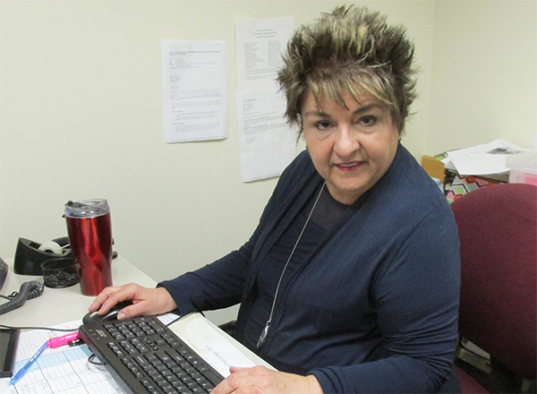 Lynn Boza at her desk