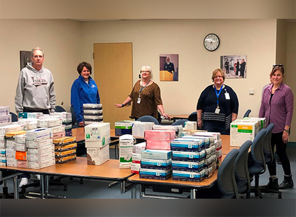 L to R: HFC School of Health and Human Services faculty and staff members Rob Bruley, Susan Shunkwiler, Lisa Hastings, Debra Szymanski, and Cynthia Scheuer collect medical supplies to donate to area hospitals. 