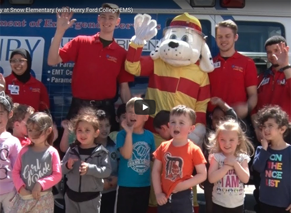 HFC students and Sparky the Fire Dog with Snow elementary students