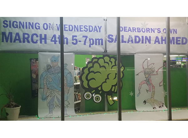 The mural in the window of Green Brain Comics in Dearborn, promoting HFC alumnus Saladin Ahmed's March 4 appearance. 