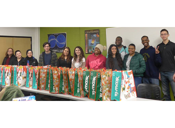 HFC Phi Theta Kappa members filled 55 bags that contained extra food and personal care items for their fellow HFC students over the winter break when the Hawks' Nest was closed. 
