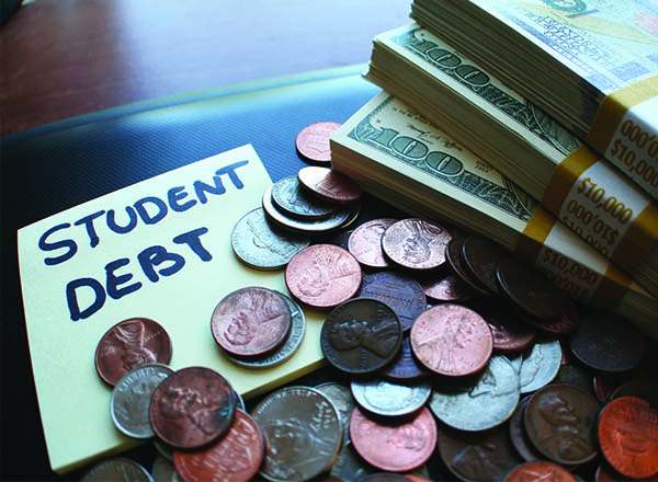An image of loose change, a stack of money, and a post it note that reads Student Debt. 
