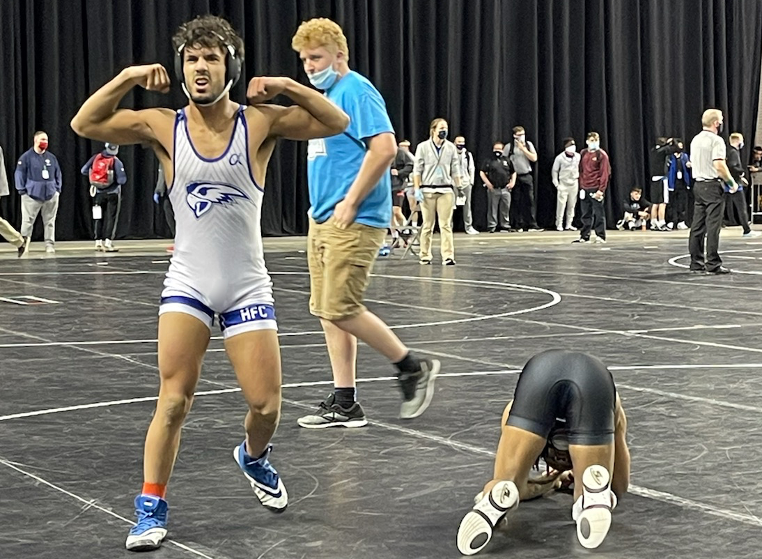 Almudhala celebrating on the mat after his victory to take 6th place at nationals