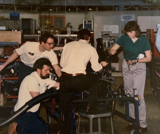 HFC alumna Linda Conti (far right) as an intern for General Motors. 