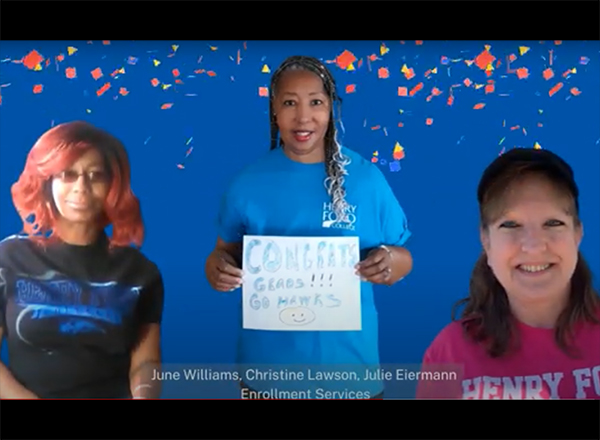 screenshot from video of three people congratulating graduates