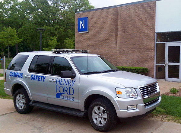 A photo of HFC Campus Safety vehicle and Campus Safety building.