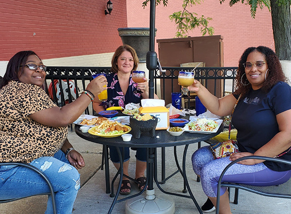 From L-R: Tamika Hister enjoys lunch with fellow HFC Enrollment Associates Jodi Kenney and Katrina Minnis. 