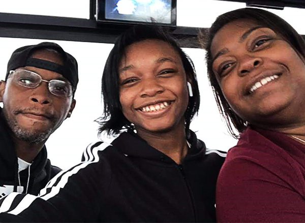 Tamika Hister (right), along with Claude Albert (left), her significant other, and her daughter, London (center).