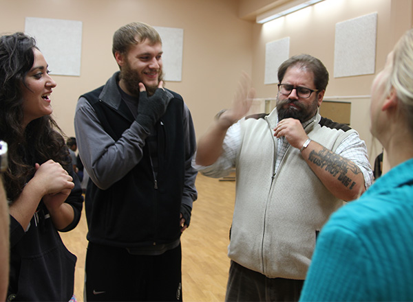 Dr. John Michael Sefel directs students during a rehearsal at Cowley County Community College. 