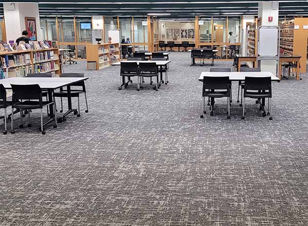 A long view of the Eshleman Library's new gray carpet. 