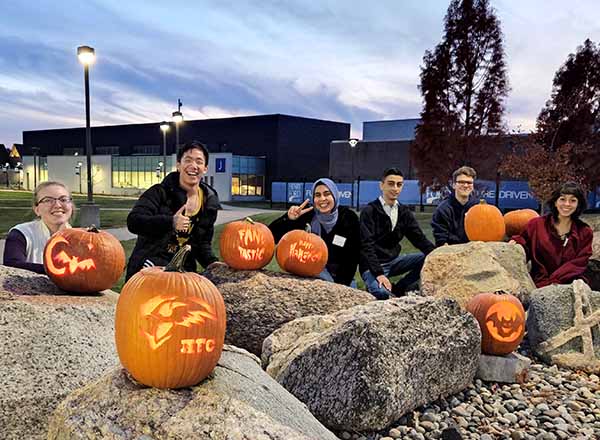 The ISS poses with their Jack o' Lanterns. Note the different designs. 