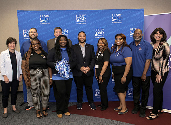 AmeriCorps CEO Michael D. Smith gathers with employees of HFC, MCAN, and AdviseMI for a group photo. 