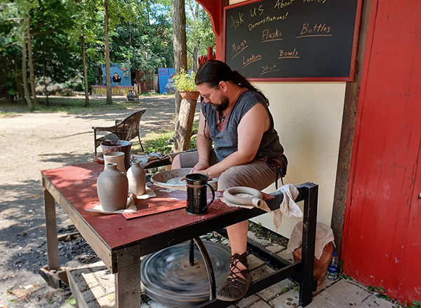 Michael George making pottery at the Renaissance Festival. 