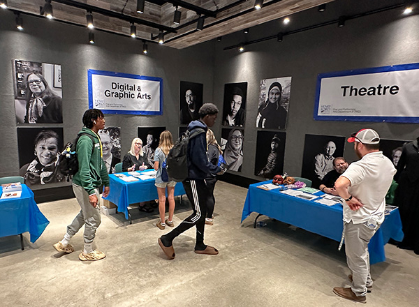 Students learn about the fine arts, theatre, and music programs in the Sisson Art Gallery. 