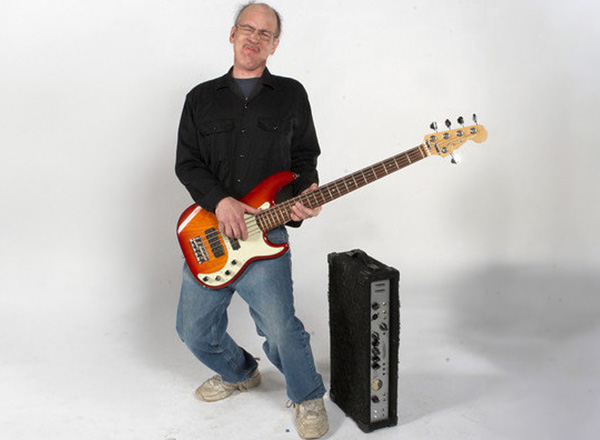 Bob Burnham poses with his bass guitar. 