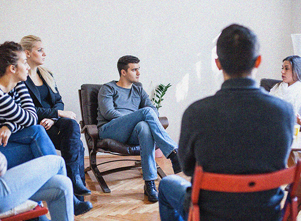 A group of people in a counseling setting