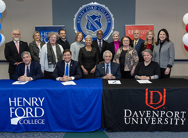 Faculty and staff from both institutions celebrate the signing of the agreement at HFC.