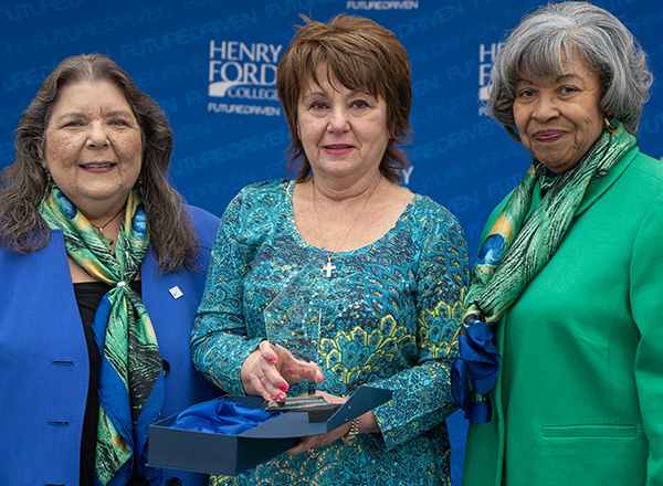HFC Executive Assistant to the President Kathy Dimitriou (center) was awarded for her decades of service to HFC. She is flanked by HFC Board Trustee Roxanne McDonald (left) and Dr. Brenda Hildreth (right). 