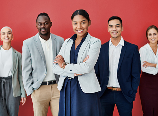 A group of young professionals dressed in modern business wear.