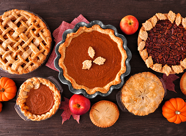 A variety of autumn pies on a table.