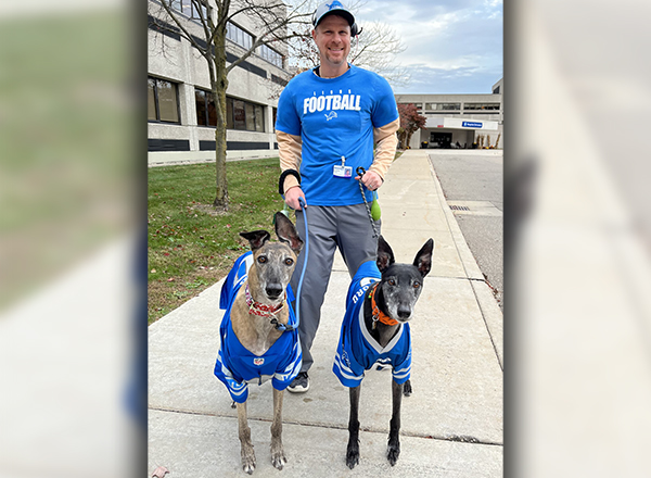 Jeremy Tabor dressed up as Detroit Lions Coach Dan Campbell for Halloween and had his two dogs decked out in Lions sweaters. 