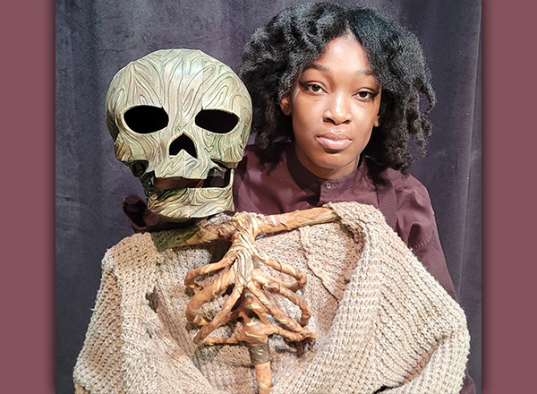 HFC student Zuri Jamal with the finished product of the skeleton puppet Katie Warden designed. 